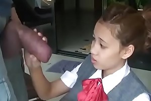 Asian schoolgirl opens yon there suck huge cock