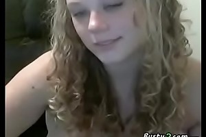 Curly blonde BBW shows her tits and pussy