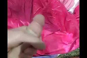 Masturbating into pink towel